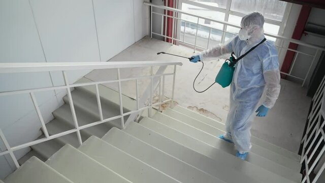 Disinfecting staircase inside the building, coronavirus precautions