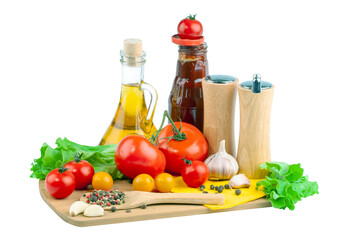 Tomatoes, tomato ketchup and tomato juice with lettuce leaves, isolated on a white background.