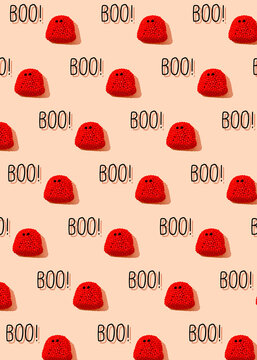 Pattern of rows of red candies resembling spooky ghosts