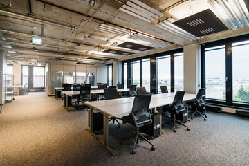 Chairs arranged at desk in modern office