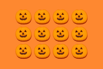 Studio shot of jack o lantern-shaped Halloween cookies