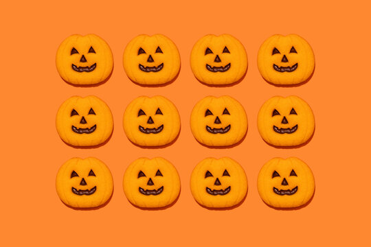 Studio shot of jack o lantern-shaped Halloween cookies