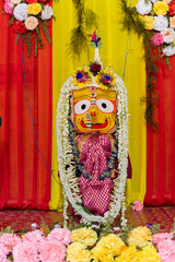 Idol of Hindu Goddess Suvodra is being worshipped with garlands for Rath jatra festival - at Howrah, West Bengal, India. Vertical image.