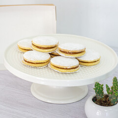 Cornstarch Alfajores stuffed with Manjar and sprinkled with sugar