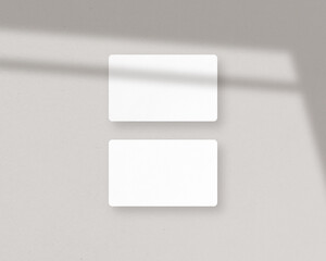 Blank white business cards mockups with shadow overlays. Mockup of two horizontal business cards. Mockup scene. Photo mockup with clipping path.