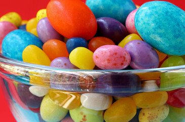 colorful easter eggs and candies in glass bowl