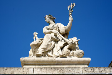 Stone statue at the entrance of Palace of Versailles on a sunny spring day. Photo taken April 30th,...