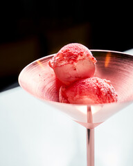 Strawberry ice cream in copper bowl, closeup view