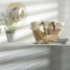 Wooden desk with shadows and home interior with window 