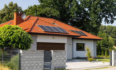 Fototapeta na wymiar solar panels on roof of house, renewable energy