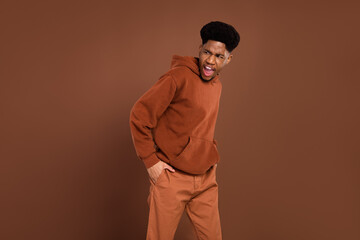 Photo of angry short hairdo young guy yell look empty space dress sportswear isolated on brown color background