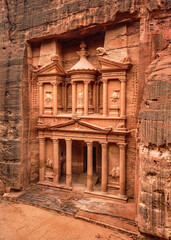 Fototapeta na wymiar Front of Al-Khazneh (Treasury temple carved in stone wall - main attraction) in Lost city of Petra