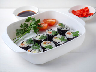 Vegetarian Sushi Maki rolls made of Cucumber, tomato, parsley.