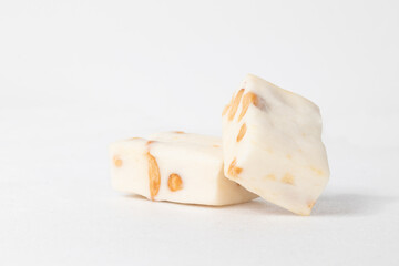 Nougat close up on white background, copy space.