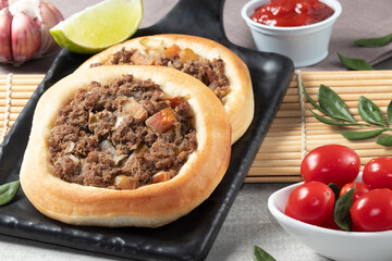 Arabic meat esfiha with a cup of coffee.