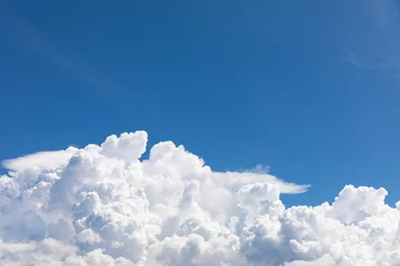 Cumulonimbus,  puffy white clouds in the blue sky © kowitstockphoto