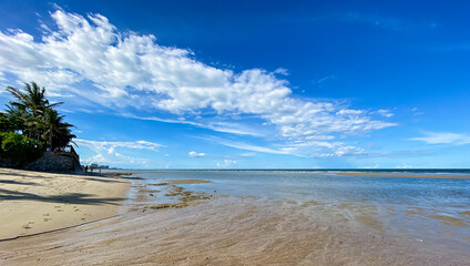 Tropical beach wave at Hua Hin Thailand in the morning.Background or wallpaper of clean sand and clear sea water that can be seen through