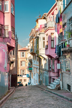 Turkey, Istanbul, Town houses along cobblestone alley in Balat neighborhood