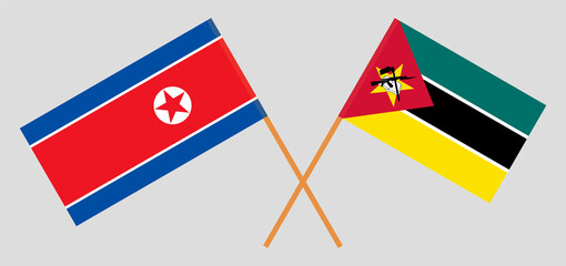 Crossed flags of North Korea and Mozambique. Official colors. Correct proportion