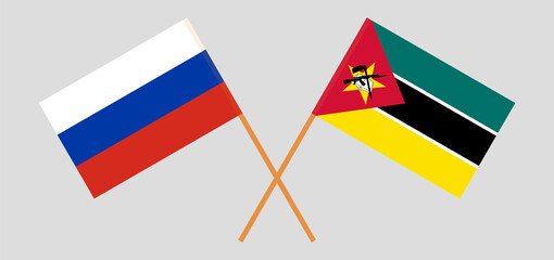 Crossed flags of Russia and Mozambique. Official colors. Correct proportion