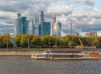  Pleasure boat on the Moscow River against the background of Moscow-City