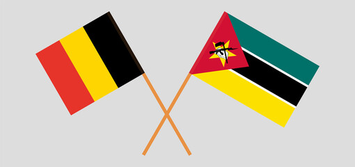 Crossed flags of Belgium and Mozambique. Official colors. Correct proportion