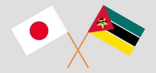 Crossed flags of Japan and Mozambique. Official colors. Correct proportion