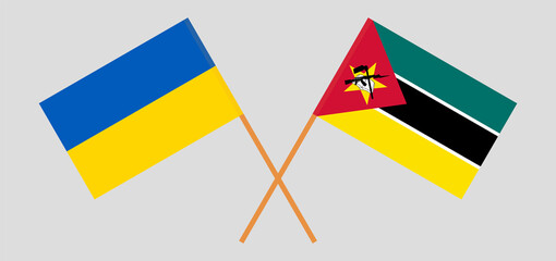 Crossed flags of Ukraine and Mozambique. Official colors. Correct proportion