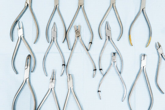 Clean dental forceps on table at clinic