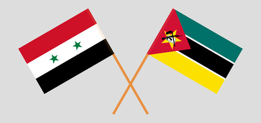 Crossed flags of Syria and Mozambique. Official colors. Correct proportion