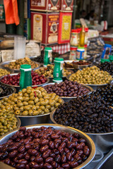 Black and green olives at the street market in Tel Aviv, Israel.