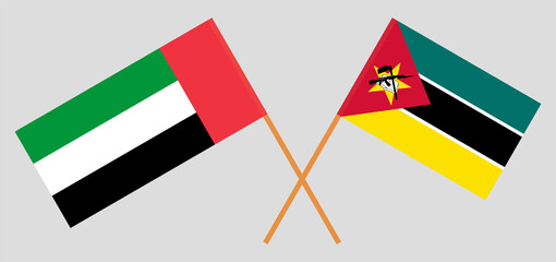 Crossed flags of the United Arab Emirates and Mozambique. Official colors. Correct proportion