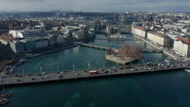 flying counter clockwise around Rhone River at center of Geneva Switzerland