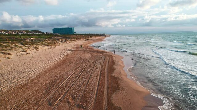 Aerial panoramic view of empty sandy beach of La Mata in the early morning. First person view motion. Costa Blanca. Province of Alicante. Torrevieja. Spain. Travel concept