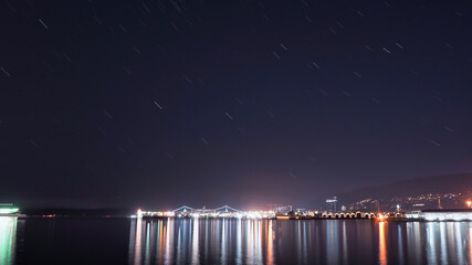 Fototapeta na wymiar A star trail picture at the Burrard inlet. Vancouver BC Canada 