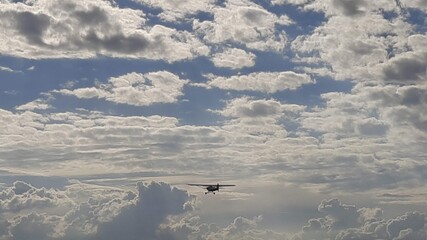 airplane flying over the clouds