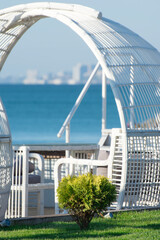 A romantic gazebo for relaxation by the sea. Seascape.