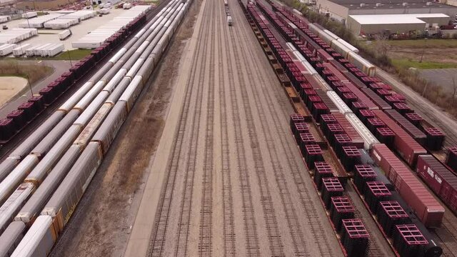 Cargo Trains On The Railway Near Stellantis Assembly Plant In Sterling Heights, Michigan. Aerial