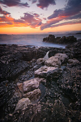 Sunset seascape of picturesque rocks on the coast of Albania