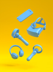 Flying gamer gears like joystick, headphones, VR glasses and controler on yellow