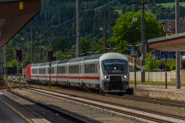 Fototapeta na wymiar Germany train in Austria mountains in Sankt Johann im Pongau in summer day