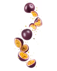 Foto op Aluminium Whole and sliced fresh passion fruit (passiflora) in the air on a white background © Krafla