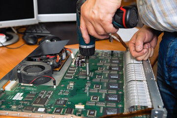 Disassembly of computer and network equipment with a screwdriver.