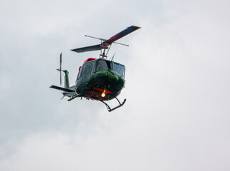 Fototapeta na wymiar British Army Air Corps ZJ969 Bell 212 pilot training helicopter flying over Saisbury Plain (SPTA) UK