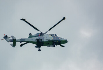 Fototapeta na wymiar British army AgustaWestland AW159 Wildcat AH1 helicopter flying over Salisbury Plain (SPTA) UK