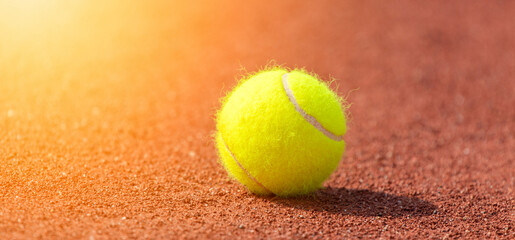 Tennis ball on a tennis clay court. Professional sport concept
