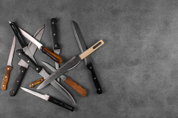 A set of used kitchen knives. Copy space.