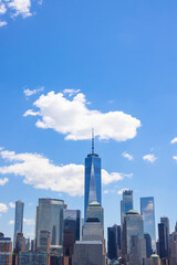 Unique shape clouds float over the Lower Manhattan skyscraper in springtime at New York City NY USA on May 14 2021. Image was taken from Jersey City NJ.