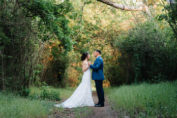 A couple in love a guy and a girl on a walk in the forest belt