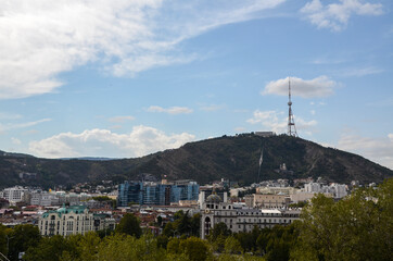 View to old town, modern architecture and mount Mtatsminda with TV Broadcasting Tower in Tbilisi,...